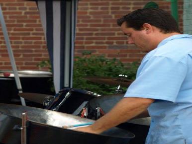 Found Sound entertainer playing steel drum