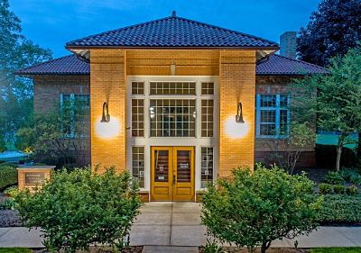 Picture of the front of the Kinsman Library taken at dusk