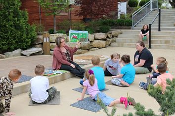 Librarian reading to a group of children
