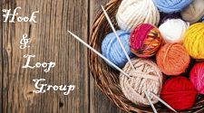 Picture of a basket of yarn and knitting needles with the text "hook and loop group"