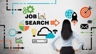 Woman standing with her back to us facing a white board with a lot of writing related to job searching