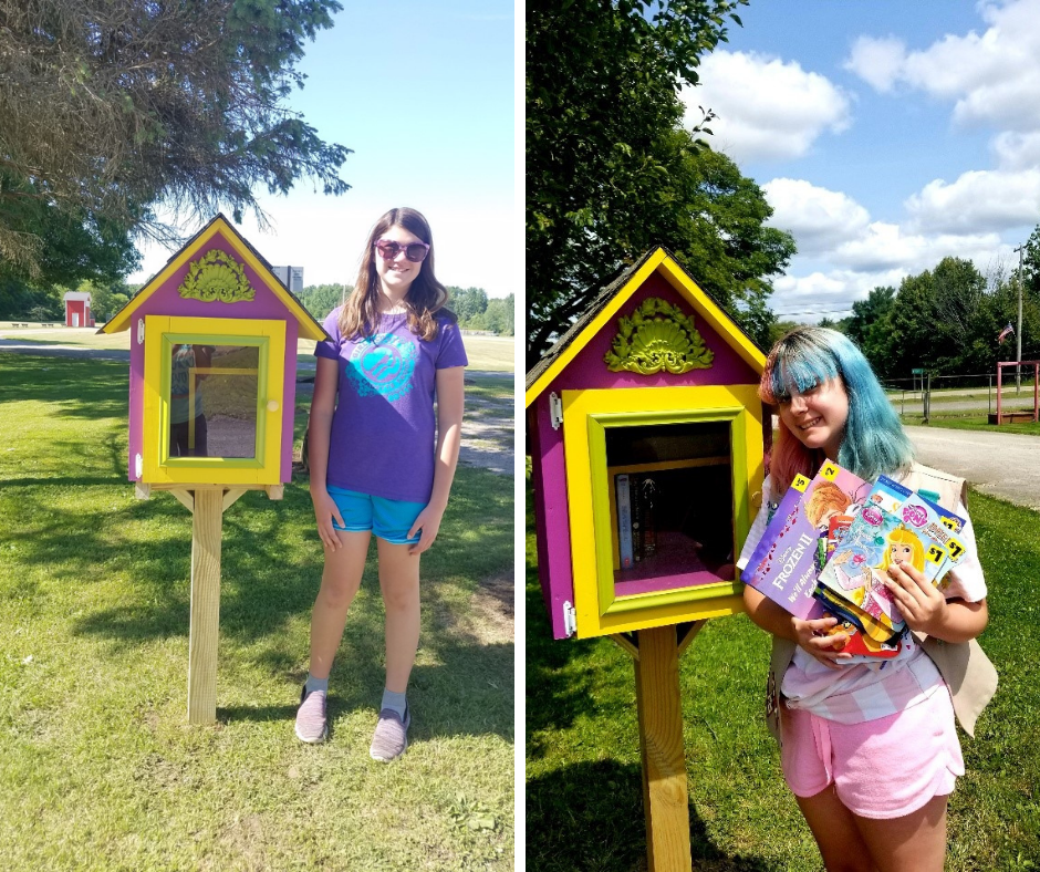 Two teenage girls standing in front of little free libraries
