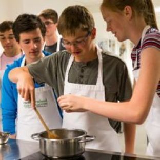 A group of teens cooking